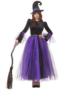 a woman in a witch costume holding a broom and wearing a black top with purple tulle