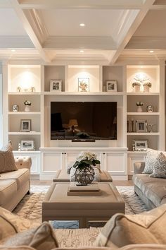 a living room filled with furniture and a flat screen tv mounted on a wall above a fireplace