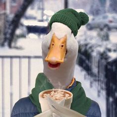 a duck wearing a hat and scarf holding a bowl of cereal in it's mouth