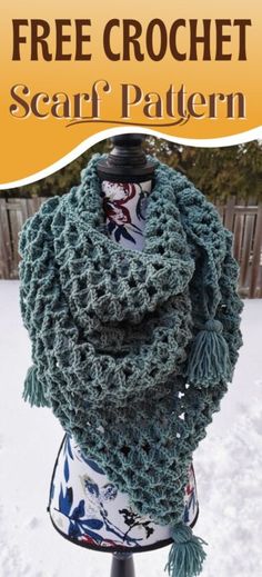 a crochet scarf on top of a mannequin in the snow