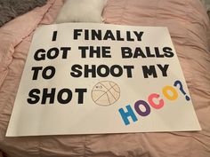 a sign that says i finally got the balls to shoot my hoo? on a bed