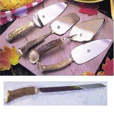 three different types of knives and spoons on a table with autumn leaves in the background