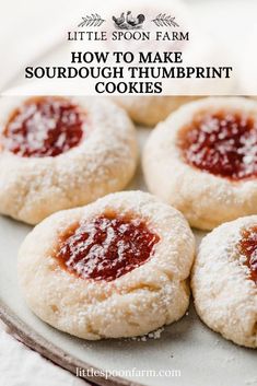 small cookies with powdered sugar on top and the words little spoon farm how to make sourdough thumbprint cookies