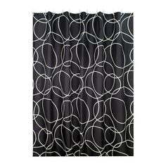 a black and white shower curtain with circles on it