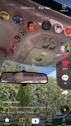 the dashboard of a car with many stickers on it