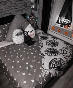 there is a bed with halloween decorations on it