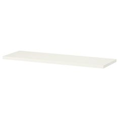 a white shelf that is on top of a wall and has no one in it