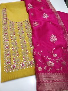 Item Overview ATHARVA Hand Embroidery Salwar Kameez/Embroidery Neck Yellow/Banarsi Silk Dupatta/Custom Stitch/Tunic/Patiala/Churridar/Anarkali Dno. CH1690 Fabric: * Shirt - Chanderi Silk- Hand Embroidered Neck - Yellow- 2.5 Mts - Beautiful Hand Embroidery * Dupatta: Banarasi silk Dupatta- All over Embroidery - 2.5 Mts- Latkans Tassels - Dark Pink * Bottom Santoon Silk 2.5 Mts. Excusive Hand Embroidered Party Wear Punjabi Suit. Customization: * Fabrics Customization: Designs Can be made in differ Patiala Salwar Kameez, Embroidery Dupatta, Unstitched Dress Material, Patiala Salwar, Pink Bottom, Embroidered Pants, Punjabi Suit, Embroidery Suits, Silk Dupatta