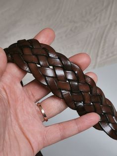 Chocolate brown braided leather belt with a silver metal belt buckle. Perfect for jeans. This belt was originally made as men's belt, but can be worn as a women's one. Size: Marked 100 cm Length (measured from the edge of the belt buckle to the end of the braided part and doesn't include the belt buckle): 46.5 inches / 118 cm Width: 1.4 inches / 3.5 cm Condition: Very good to excellent vintage condition, with some scratches on the belt buckle. Nicely distressed vintage condition! Brown Leather Strap Belts For Everyday, Brown Leather Strap Belt For Everyday Use, Brown Leather Strap Belt Buckle For Everyday Use, Brown Belt With Antique Buckle For Everyday Use, Vintage Brown Belt With Leather Strap, Vintage Handmade Brown Belt Buckles, Vintage Handmade Brown Belt, Handmade Leather Belt Buckles In Brown, Handmade Brown Leather Belt Buckles