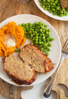 a plate with meatloaf, mashed potatoes and vegetables