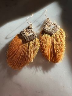 These light weight fringe earrings are a pop of golden yellow … perfect all day, everyday ! Trendy Gold Fringe Earrings, Trendy Gold Tassel Earrings With Fringe, Brown Tassel Earrings For Summer, Summer Brown Tassel Earrings, Yellow Bohemian Earrings With Latkans, Bohemian Yellow Earrings With Latkans, Trendy Fringe Drop Earrings, Yellow Fringe Jewelry For Party, Yellow Fringe Tassel Earrings