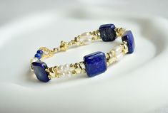 Genuine Blue Lapis Lazuli Statement Bracelet | Natural Lapis Lazuli, White Freshwater Pearl Bracelet in Gold | Lapis Square Bracelet by StellaLingJewelry on Etsy Elegant Handmade Lapis Lazuli Bracelets, Square Bracelet, Blue Lapis Lazuli, Freshwater Pearl Bracelet, Jewellery Ideas, Square Bead, Elegant Bracelet, White Freshwater Pearl, Blue Lapis