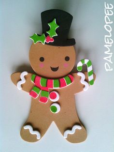 a gingerbread man ornament with candy canes