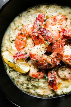 shrimp and grits served in a black bowl