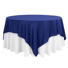 a blue and white table cloth on top of a round table