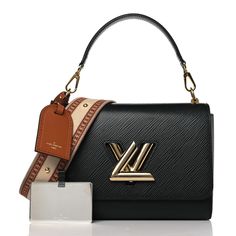 This is an authentic LOUIS VUITTON Epi Twist Top Handle Shoulder Bag MM in Black. This stylish shoulder bag is crafted of textured epi leather in black. The bag features a detachable leather top handle with gold hardware, an optional multicolored monogramed canvas strap, and a gold LV turn lock logo. This opens the bag to a black microfiber interior with patch pockets. Lock Logo, Oversized Bag, Twist Top, Dior Jewelry, Stylish Shoulder Bag, Wallet Fashion, Hobo Handbags, Luxury Accessories, Bag Straps