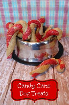 candy cane dog treats in a metal bowl