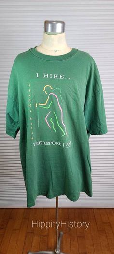 "22.5\" Pit to pit measurement 29.5\" Length Banff Canada I Hike...Therefore I Am deep colorful philosophical vintage hiking tee. Great t shirt for the hiker and vintage lover in your life. The colorful hiking graphic with a hiking pole really stands out on this green single stitch t shirt. Small endearing hole in collar. See photos. Banff Canada written on the side of the graphic." Hiking Graphic, Vintage Hiking, Stitch T Shirt, Banff Canada, Band Hoodies, Hiking Shirts, Vintage Lover, Great T Shirts, Work Ideas