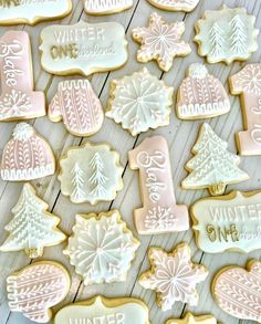 christmas cookies decorated with frosting and icing on a wooden table, including one for each cookie