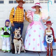 a family dressed up as toy story characters posing for a photo in front of a garage door