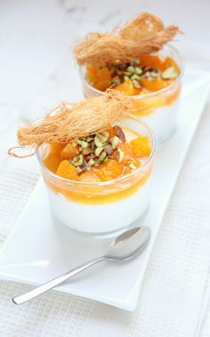 two small bowls filled with food on top of a white plate