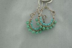 This is the perfect option for those who like cool, unique jewelry and the luxury, shine of sterling silver, turquoise. These earrings is well made, cute and/or elegant in design, and very desirable. The earrings have a drop part. The drop part has the shape of the semicircle on chains. The earrings are decorated with balls from turquoise. The clasp is in very good working condition. ♥ Age/Era: Circa before the 2000s. ♥ There is no hallmark, but it is sterling .925.(tested with acid). ♥ The earr Turquoise Dangle Hoop Earrings Wire Wrapped, Turquoise Wire Wrapped Dangle Hoop Earrings, Blue Sterling Silver Wire Wrapped Hoop Earrings, Blue Wire Wrapped Sterling Silver Hoop Earrings, Elegant Handmade Turquoise Hoop Earrings, Elegant Turquoise Hoop Earrings, Turquoise Hoop Earrings As A Gift, Turquoise Hoop Earrings For Gift, Unique Turquoise Jewelry For Everyday