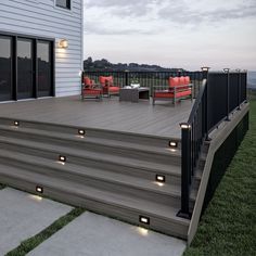 an outdoor deck with lights on it