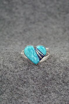 This turquoise, onyx, opalite and sterling silver inlay ring was made by Navajo silversmith Michelle Willie. The inside of the band is signed and stamped .925. Size: 8 adjustable Length: 1/2" Width: 5/8" Free shipping on all orders! We ship with USPS and always include tracking. All orders ship within a day of payment. Returns are accepted up to 30 days after you receive your order. Just send us a message. Our shop offers cash back or store credit. The item must be returned in the same condition Artisan Rings With Inlay For Anniversary, Southwestern Style Rings With Polished Finish, Turquoise Inlay Ring As A Gift, Turquoise Inlay Ring As Gift, Turquoise Inlay Ring Gift, Turquoise Inlay Ring For Gift, Southwestern Inlay Jewelry For Anniversary, Southwestern Style Inlay Jewelry For Anniversary, Sterling Silver Inlay Ring