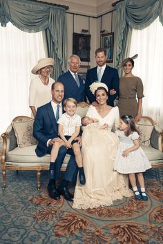 a group of people posing for a family photo