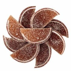 an orange and brown flower made out of sugar on a white background with candy store logo