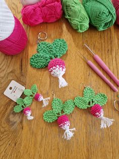 several crocheted items on a wooden table