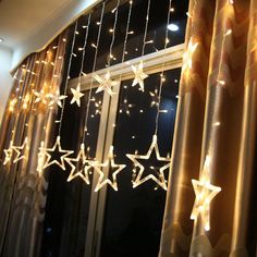 the curtain is decorated with stars and lights