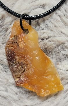 This piece of raw fire agate was hand collected by me in California, and the hole was hand drilled.

The necklace cord is 17" long with an extra 2" chain that can be adjusted.  It's easy to put on and take off with the lobster claw closure.

The crystal / agate / chalcedony measures approximately 1 1/2" long and 1/2" wide.

#agate #fireagate #California #rocks #rock #rocksandminerals #necklace ##rocknecklace #crystal #handmade #stone #Etsy #shopping Rock Crystal Jewelry, Rock Pendant, Apache Junction, Rock Necklace, Necklace Cord, Fire Agate, Agate Necklace, Rock Crystal, Rocks And Minerals