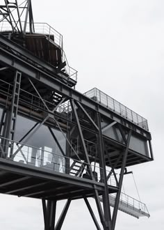 a tall metal structure with lots of windows on it's sides and balconies