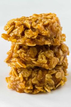 three granola cookies stacked on top of each other in front of a white background