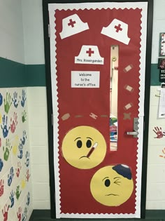 a classroom door decorated with handprints and emotictive designs for the first day of school