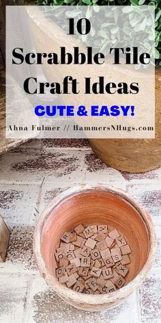 a wooden bowl filled with letters on top of a tiled floor next to a potted plant