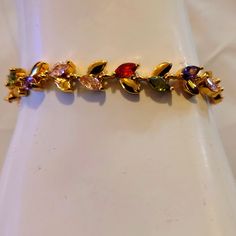 New With Tag Beautiful Leaf Bracelet Multicolor Multi-stone Gold Bracelet As Gift, Multicolor Cubic Zirconia Tennis Bracelet Gift, Gold Cubic Zirconia Multi-stone Bracelets, Elegant Multicolor Gold-plated Bracelets, Elegant Multicolor Gold Plated Bracelets, Multicolor Gold Jubilee Bracelet, Multicolor Gold Bracelet Gift, Leaf Bracelet, Red Purple