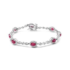 Behold this stunning link bracelet, fit for a queen. Crafted from lustrous 10K white gold, it features eight natural heat treated red rubies, each elegantly cut into an oval shape measuring 4.5mm x 3mm. The rubies are perfectly complemented by eight sparkling round diamonds with a total weight of 0.05 cttw. These diamonds, with their H-I color and SI1-SI2 clarity, are set in prongs to ensure maximum brilliance and fire. This exquisite bracelet measures 7 inches in length and is designed to fit s Elegant Red Chain Bracelet With Jubilee Design, Elegant Red Jubilee Chain Bracelet, Classic Red Diamond Bracelets, Elegant Red Jubilee Bracelet, White Gold Ruby Gemstone Bracelet, Elegant Red Oval Diamond Bracelet, Elegant Red Oval Bracelets, Elegant Red Sterling Silver Bracelet, Elegant Red Sterling Silver Bangle Bracelet