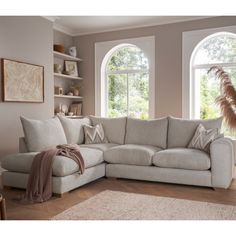 a living room scene with focus on the corner sofa