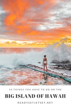 a woman standing on top of a surfboard in the ocean with text overlay that reads, 10 things you have to do on the big island of hawaii