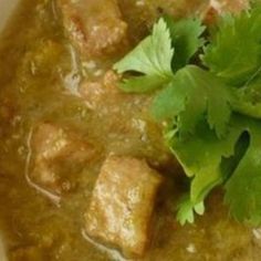 a white bowl filled with meat and cilantro