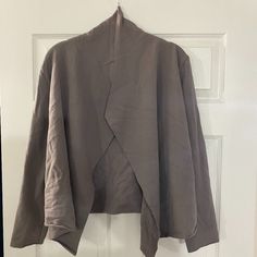 I Bought This A Few Months Ago From One Of My Favorite Sustainable Canadian Brands And I Love The Look Of It, But Have Never Worn It Out Of The House. It Just Doesn't Look Good On Me Sadly. It Would Be Good To Wear To Work As A Comfy Warm Blazer/Cardigan Thing. It's A Really Pretty Mink/Dusky Purple Color. :(. Fabric Is 66% Bamboo; 26% Organic Cotton; 6% Spandex. As Mentioned, It's Practically Brand New So Has No Markings. Measurements Bust From Pit To Pit - 19 In; Length - 22 1/4 In In; Back Sh Taupe Outerwear For Fall Loungewear, Fitted Cotton Outerwear With Open Front, Fitted Cotton Open Front Outerwear, Taupe Outerwear For Fall Layering, Fall Layering Taupe Outerwear, Fall Taupe Outerwear For Layering, Fitted Open Front Outerwear For Loungewear, Taupe Long Sleeve Outerwear For Layering, Long Sleeve Taupe Outerwear For Work