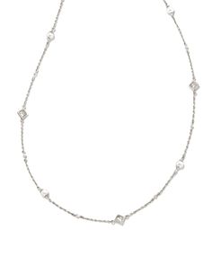 Simple yet oh-so-sparkly, the Michelle 14k White Gold Strand Necklace in White Pearl is the epitome of modern timelessness. Featuring iridescent pearls and princess cut White Diamonds, elevate any ensemble with this layerable choker necklace.

We have taken steps to ensure that, when applicable, our diamonds are conflict free by requiring our suppliers to comply with the Kimberley Process. Elegant White Sparkling Necklace, Modern Silver Pearl Necklace For Formal Occasions, Modern Silver Pearl Necklace For Formal Events, Silver Jewelry With Pearl Charm In Refined Style, Refined Silver Jewelry With Pearl Charm, Iridescent Pearl, Gold Jewelry Necklace, White Gold Necklaces, Women Diamond