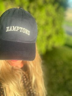 Look chic on the beach with this stylish "Hamptons" hat! The HAMPTONS New York logo embroidered on the front is perfect for a day of summer fun. One size fits most, so pack it up and show off your Hamptons style on vacation (or your backyard!). Brimmed Dad Hat For Summer Beach, Summer Beach Dad Hat With Embroidered Logo, Summer Vacation Hats With Embroidered Logo, Summer Adjustable Baseball Cap With Embroidered Logo, Adjustable Summer Baseball Cap With Embroidered Logo, Summer Brimmed Hat With Embroidered Logo, Summer Hats With Embroidered Logo, Summer Wide Brim Hat With Embroidered Logo, Hamptons New York