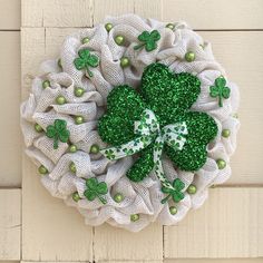 a st patrick's day wreath with shamrocks on it