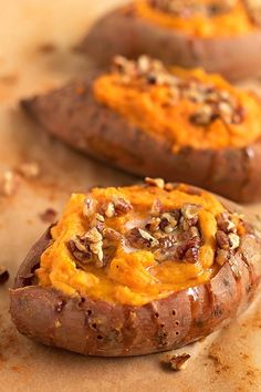 baked sweet potatoes topped with cheese and nuts