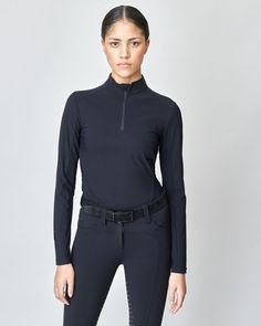 Women’s riding shirt, performance sun shirt for riding with uv protection. A long sleeve schooling top for jumping, dressage, eventing and hunting. Riding Shirts, Sun Shirt, Dressage, Signature Logo, Uv Protection, Black Shirt, Built In, Sun, Elastic