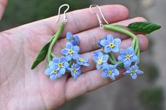 Forget-Me-Not Twig Earrings - Silver Fittings These charming Forget-Me-Not twig earrings are elegantly mounted on silver fittings. Perfect for everyday wear or as a stunning addition to a special outfit. Each flower is meticulously handcrafted from cold porcelain clay, ensuring a unique touch to your accessory collection. Note: The earrings shown in the photo have been sold. You will receive a handcrafted copy of these earrings. Due to the handmade nature of this product, each pair may have slig Twig Earrings, Elegant Wedding Jewelry, Fondant Flowers, Gift For Bride, Forget Me Nots, Porcelain Clay, Wedding Jewelry Earrings, Cold Porcelain, Floral Earrings