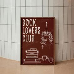 a book lover's club sign sitting on top of a counter